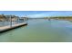 Scenic waterfront vista featuring a wooden dock, boats, and distant buildings, offering an inviting atmosphere at 968 Cummings Cir, Mount Pleasant, SC 29464