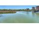 Scenic waterfront showcasing calm water with a distant view of trees and a boat storage facility, creating a tranquil ambiance at 968 Cummings Cir, Mount Pleasant, SC 29464