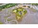 Aerial view highlights a private island estate featuring a large pond at 000 Remington Trl, Johns Island, SC 29455