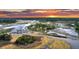 Aerial view showcases the lush landscape surrounding the tidal waterways at 000 Remington Trl, Johns Island, SC 29455