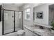 Modern bathroom features glass enclosed shower, granite vanity and large, bright window at 000 Remington Trl, Johns Island, SC 29455
