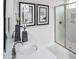 Modern bathroom featuring sleek fixtures, marble countertops, and a glass-enclosed shower for a spa-like experience at 000 Remington Trl, Johns Island, SC 29455