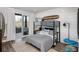 Cozy bedroom with a bunk bed, modern decor, and access to a private outdoor balcony at 000 Remington Trl, Johns Island, SC 29455