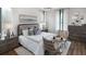 Bright bedroom with rustic wood accents, contemporary decor, and light neutral finishes at 000 Remington Trl, Johns Island, SC 29455