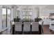 Elegant dining room with modern chandelier and stylish decor seamlessly transitions to the adjacent kitchen at 000 Remington Trl, Johns Island, SC 29455