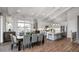 Bright dining room with a kitchen island, stainless steel appliances, an adjacent dining table, and hardwood floors at 000 Remington Trl, Johns Island, SC 29455