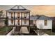 Stunning 3 story home with a metal roof, grand staircases, and beautiful decks and patios at 000 Remington Trl, Johns Island, SC 29455