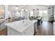 Bright, open kitchen features a large island, stainless steel appliances, and easy access to living and dining areas at 000 Remington Trl, Johns Island, SC 29455