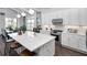 Modern kitchen with a large island, stainless steel appliances, and a seamless flow to the adjacent dining area at 000 Remington Trl, Johns Island, SC 29455