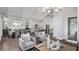 Large living area featuring an open floor plan, hardwood floors, modern furniture, and vaulted ceilings at 000 Remington Trl, Johns Island, SC 29455