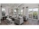 Open living room with hardwood floors, modern furnishings, and sliding glass doors to the outdoor deck at 000 Remington Trl, Johns Island, SC 29455
