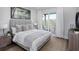 Serene bedroom features a comfortable bed, soft textures, and access to a balcony with beautiful views at 000 Remington Trl, Johns Island, SC 29455