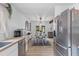 Open-concept layout flows from the modern kitchen to dining area with decor and stylish furnishings at 1024 Willowood Ave, Goose Creek, SC 29445
