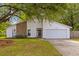 Charming single-Gathering home with white siding, stone accents, and a spacious two-car garage at 1024 Willowood Ave, Goose Creek, SC 29445