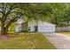 Charming single-Gathering home with white siding, stone accents, and a spacious two-car garage at 1024 Willowood Ave, Goose Creek, SC 29445