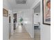 Bright hallway with hardwood floors, leading to the living room and bedroom at 1024 Willowood Ave, Goose Creek, SC 29445