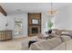Inviting living room featuring a stone fireplace, ample natural light, and a comfortable sectional sofa at 1024 Willowood Ave, Goose Creek, SC 29445
