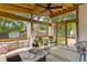 Inviting screened patio with comfortable seating, wooden ceiling, and outdoor decor at 1024 Willowood Ave, Goose Creek, SC 29445