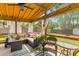 Relaxing screened patio with comfortable seating, overhead lighting, and views of the backyard at 1024 Willowood Ave, Goose Creek, SC 29445