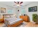Comfortable bedroom with natural light, soft rug, and serene decor at 106 Newington Rd, Summerville, SC 29485