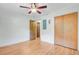 Bedroom with hardwood floors and ceiling fan with adjoining bathroom at 106 Newington Rd, Summerville, SC 29485