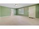 Spacious bedroom with neutral carpet, a window overlooking the yard, and an exterior door at 106 Newington Rd, Summerville, SC 29485