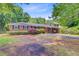 Inviting brick home with neat landscaping and a convenient carport at 106 Newington Rd, Summerville, SC 29485