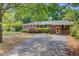 Classic brick home with a covered porch and a spacious driveway at 106 Newington Rd, Summerville, SC 29485