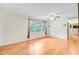 Bright living room features hardwood floors and a large window with garden view at 106 Newington Rd, Summerville, SC 29485