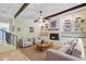 Cozy living room with a fireplace, built-in bookshelves, and beamed ceiling at 106 Newington Rd, Summerville, SC 29485