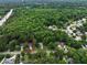 Aerial view of a home located in a wooded neighborhood, surrounded by mature trees at 109 Holly St, Summerville, SC 29485