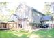 View of a backyard featuring a privacy fence, lawn, and the exterior of the home at 109 Holly St, Summerville, SC 29485