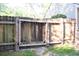 Wooden backyard gate in a wooden fence with a latch at 109 Holly St, Summerville, SC 29485