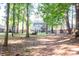 Private backyard with mature trees and landscaping for a peaceful outdoor living experience at 109 Holly St, Summerville, SC 29485