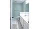 Light and bright bathroom has tile flooring, double vanity, and a soft, blue color scheme at 109 Holly St, Summerville, SC 29485