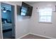 Comfortable bedroom with mounted television, carpeting, and easy access through a doorway to an adjacent bedroom at 109 Holly St, Summerville, SC 29485