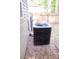 Exterior shot of an air conditioning unit on gravel near the siding of a house at 109 Holly St, Summerville, SC 29485