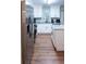 Bright kitchen with white cabinets, stainless steel appliances, and granite countertops on an island at 109 Holly St, Summerville, SC 29485