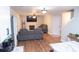 Comfortable living room with a fireplace, hardwood floors, modern furnishings, and natural light at 109 Holly St, Summerville, SC 29485