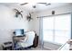 Bright home office with a large window, ceiling fan, and decorated with mounted birds at 109 Holly St, Summerville, SC 29485