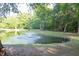 Community pond with a fountain, surrounded by green space and a walking path at 109 Holly St, Summerville, SC 29485