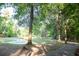 Picturesque pond with a fountain, surrounded by trees and a paved walking path at 109 Holly St, Summerville, SC 29485