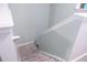 Carpeted staircase with white trim and gray walls leading to the upper level of the home at 109 Holly St, Summerville, SC 29485