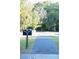 Community sign for Sawmill Branch Trail with a paved path winding through mature trees at 109 Holly St, Summerville, SC 29485