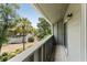 Private balcony featuring a neighborhood view framed by lush trees and a blue sky at 1142 Village Creek Ln # 4, Mount Pleasant, SC 29464
