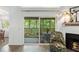 Relaxing screened balcony off the living room with a table and chairs offers a peaceful retreat and views of lush greenery at 1142 Village Creek Ln # 4, Mount Pleasant, SC 29464