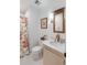 Bathroom with hexagon tile, framed mirror, and a floral shower curtain at 1142 Village Creek Ln # 4, Mount Pleasant, SC 29464