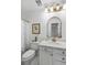Bright bathroom with marble countertops, gold fixtures, and elegant decor at 1142 Village Creek Ln # 4, Mount Pleasant, SC 29464