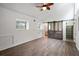 Bedroom featuring wood look floors and sliding barn doors to the bathroom at 1142 Village Creek Ln # 4, Mount Pleasant, SC 29464