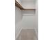 Walk-in closet with carpeted floor and high shelf for ample storage space at 1142 Village Creek Ln # 4, Mount Pleasant, SC 29464